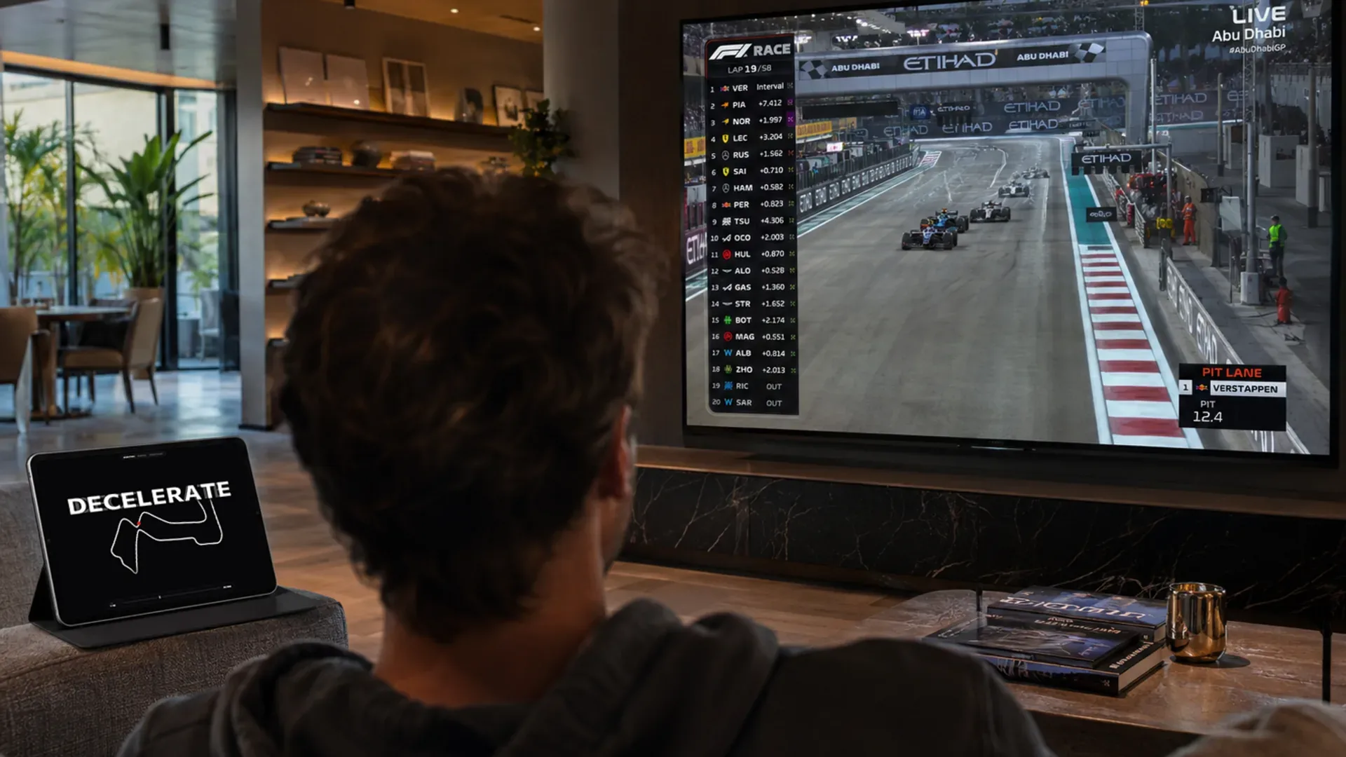 TypeTelemetry on a living room TV during a race broadcast